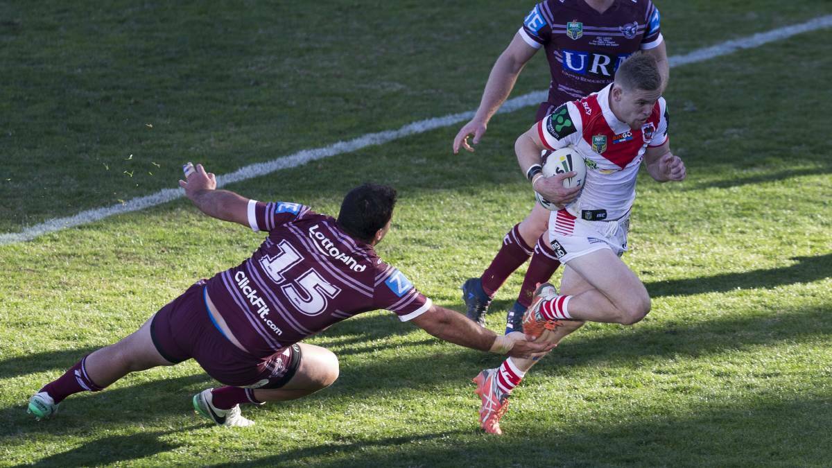 No stopping him: Penshurst RSL junior Matt Dufty scored a try on his NRL debut as St George Illawarra thrashed Manly on Sunday. Picture: Craig Golding/AAP
