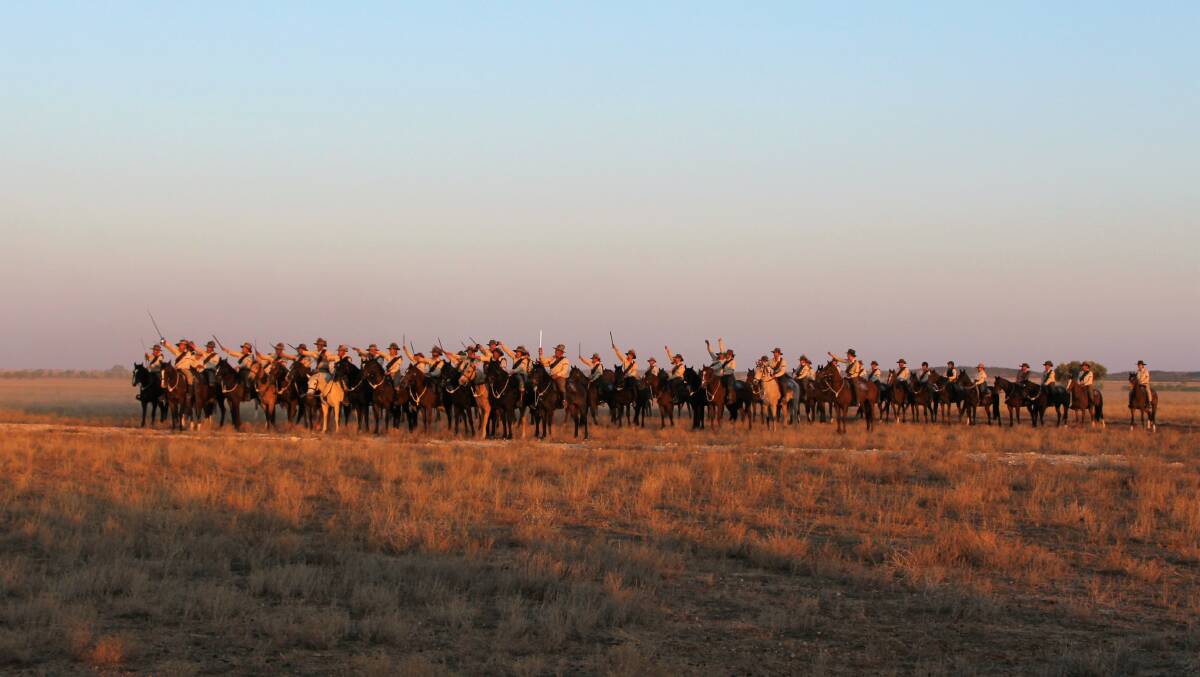 Confronting: After a gallop across the plains, the re-enactment troop halted and drew their mock bayonets to salute onlookers at the sunset extravaganza dinner at Bladensberg National Park. Pictures: Sally Cripps.