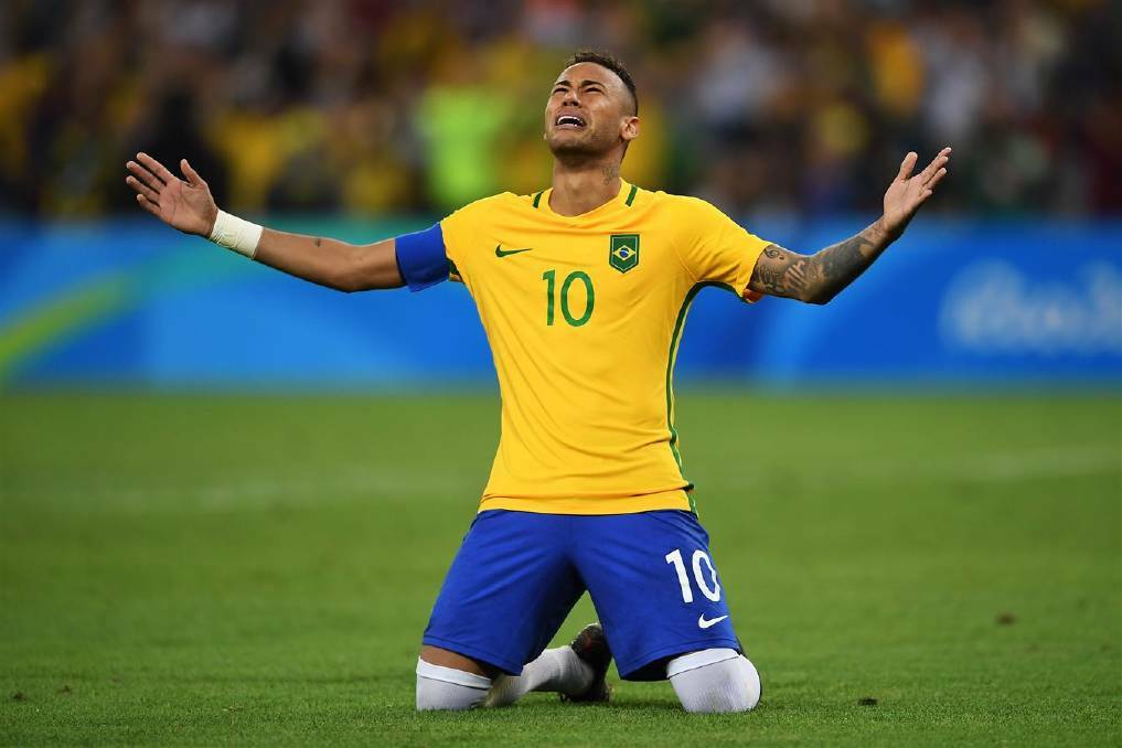 DAY 15: Neymar of Brazil celebrates scoring the winning penalty in the penalty shoot out during the Men's Football Final between Brazil and Germany. Photo: Laurence Griffiths/Getty Images 