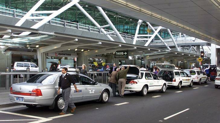 Taxis drop off passengers at Sydney Airport. Photo: Robert Pearce