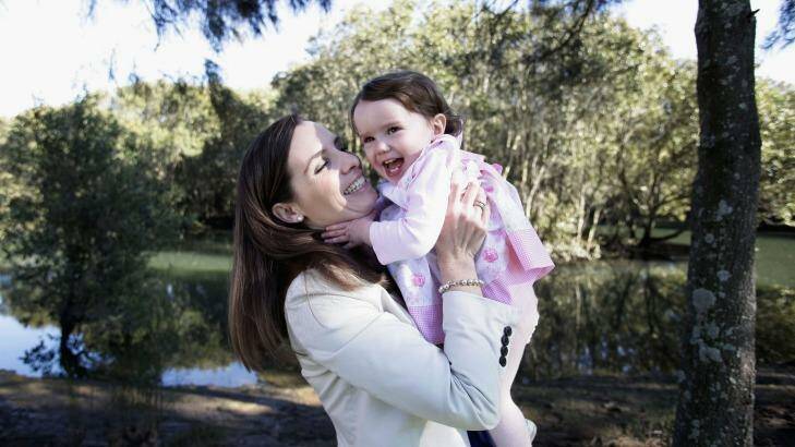 Labor MP Courtney Houssos, pictured with her daughter Anna, wants parliament to change the rules banning young children from the House. Photo: Fiona Morris