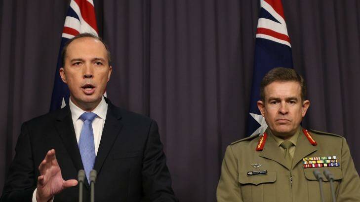 Immigration minister Peter Dutton and Major General Andrew Bottrell at Parliament House on Friday. Photo: Andrew Meares