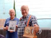 Kevin Trevitt is presented with his Certificate of Exellence  by the Bayside Men's Shed volunteers.