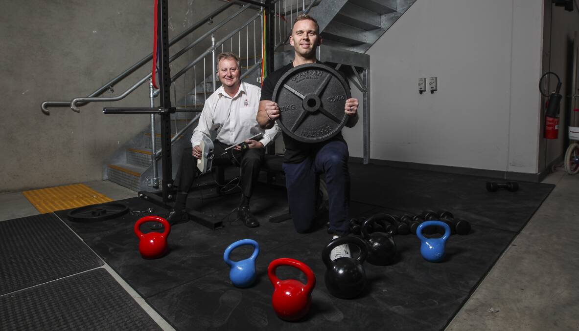 Made in Aus: Kieran Berry and Shane Rolton with some of the products made by Spartan Gym Equipment. Picture: Simon Bennett