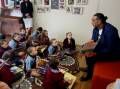 Adam Goodes reads to the kids at Curran Public School. Pictures: Chris Lane
