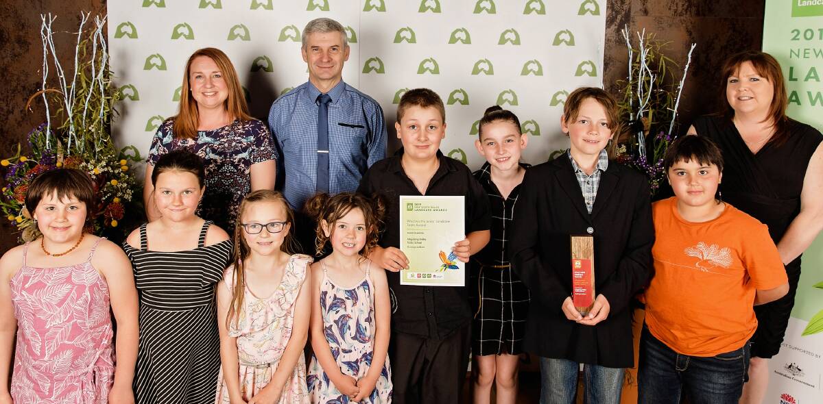 Teachers and students from Megalong Valley Public School accept the Woolworths Junior Landcare Team Award. Picture by Pennie Hall