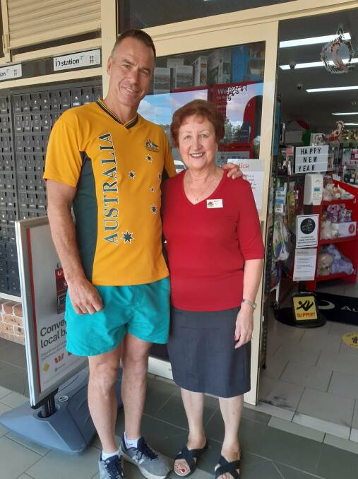 Matthew Reid with Maria from Silverdale Post Office who has already donated to support the charity walk. Picture: Supplied
