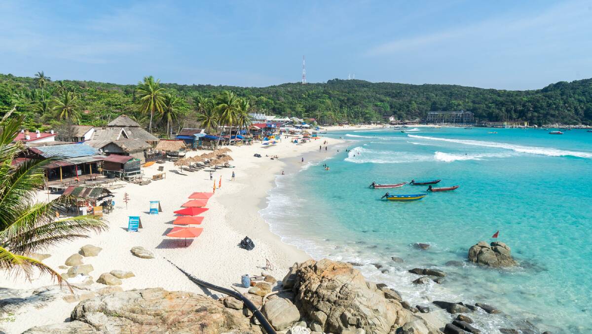 Longboats wait to take people around the island from the main beach of
Perhentian Kecil. Pictures: Michael Turtle