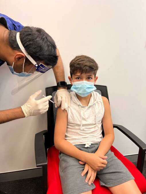 First dose: Noah, 11, receives his first COVID-19 vaccination on January 10. Picture: Supplied