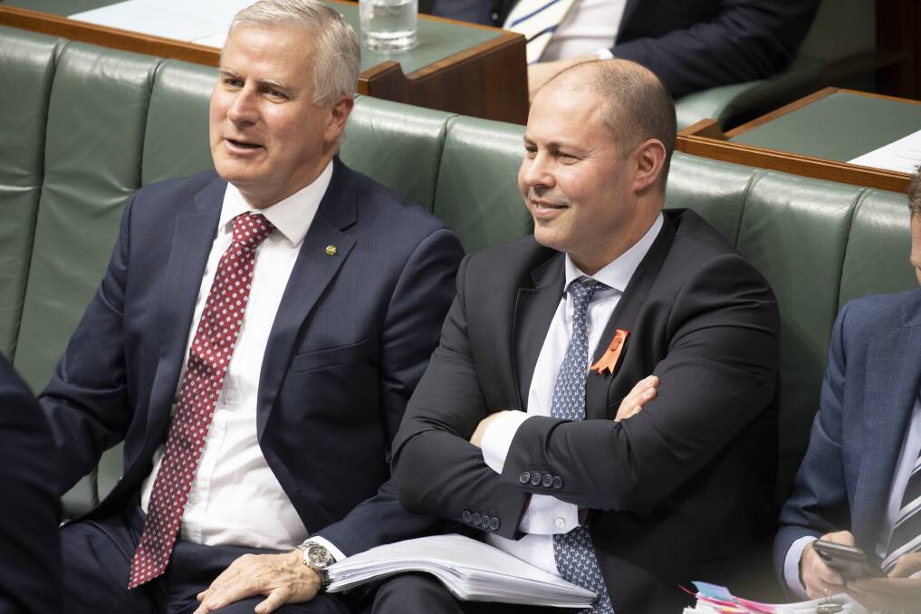 Deputy Prime Minister Michael McCormack, left, has criticised banks' "virtue signalling", and Treasurer Josh Frydenberg is backing a parliamentary inquiry into their decisions to stop financing thermal coal projects. Picture: Sitthixay Ditthavong