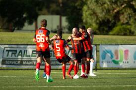 Rockdale Ilinden players celebrate a goal against Sydney Olympic in the Match of the Round. Picture NSW Football