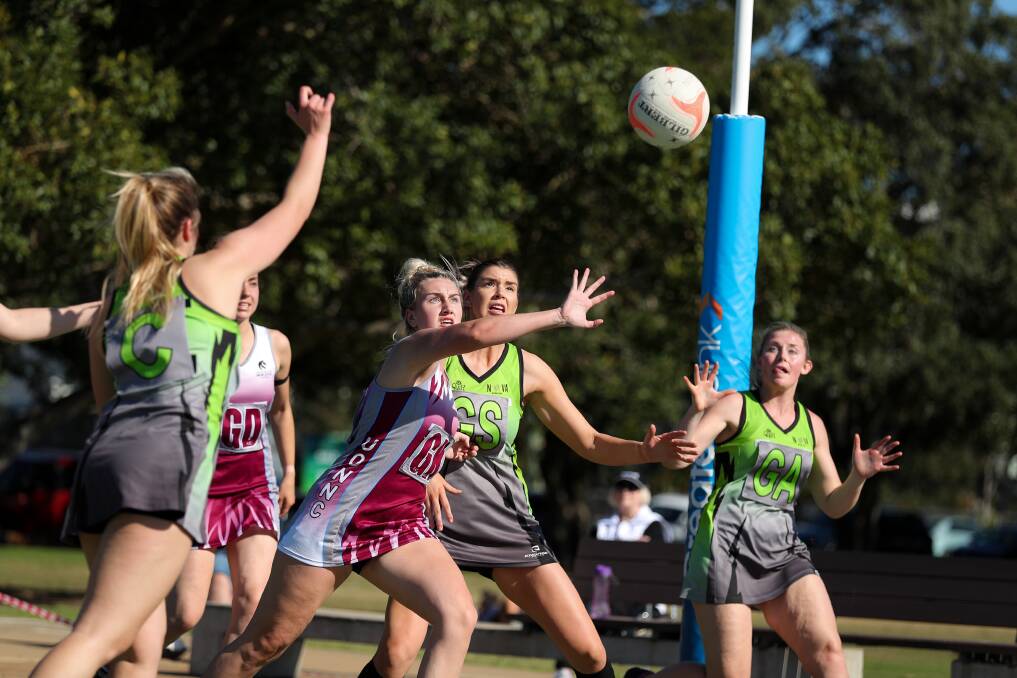 CONTEST: Nova's and Uni players during a Newcastle Championship Netball match. Picture Max Mason-Hubers