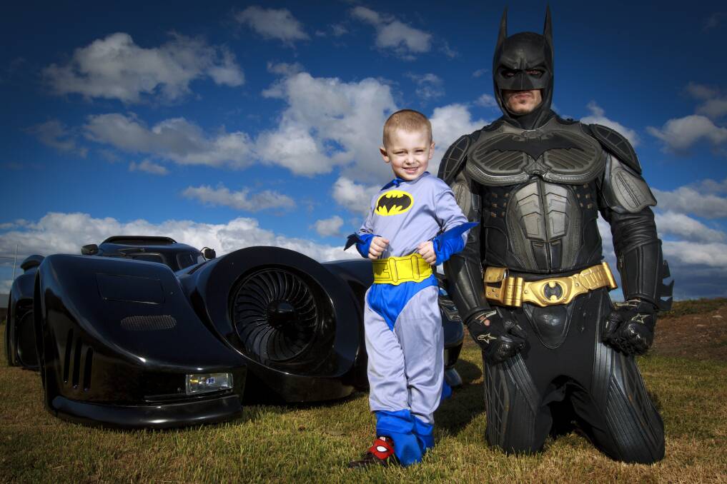 Dylan Byczkov, 4, meets his hero Batman. The staff at Bambino's Oran Park arranged for the special visit from Zac Mihajlovic after Dylan had to have emergency brain surgery. Picture: Jonathan Ng