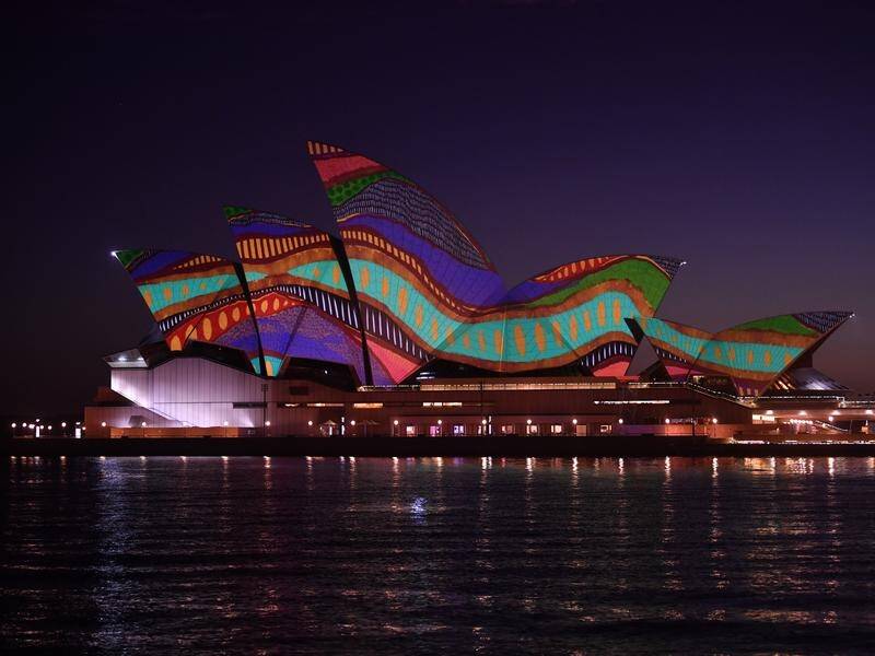 The Sydney Opera House was lit up at dawn on Tuesday with an Indigenous artwork titled Angwirri.