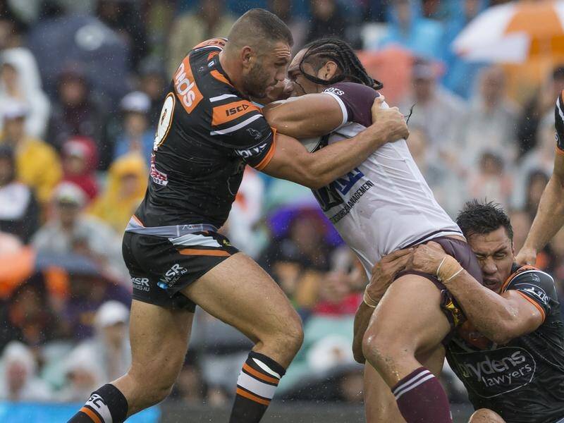 Robbie Farah (L) has scored two tries in the Wests Tigers' 20-6 season-opening NRL win over Manly.