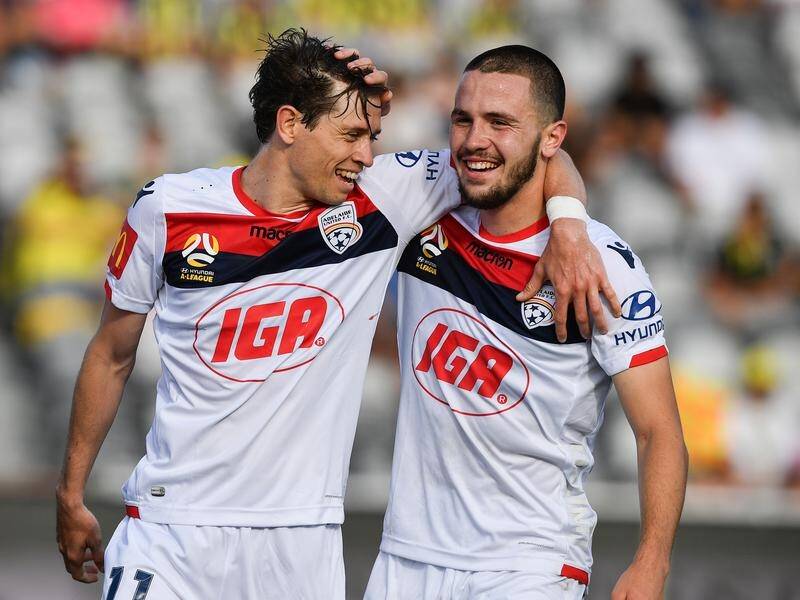 Apostolos Stamatelopoulos (right) and Craig Goodwin celebrate a goal in their win over the Mariners.