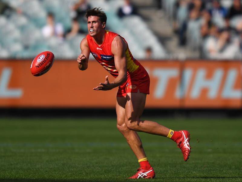 David Swallow will miss Gold Coast's AFL clash with North Melbourne due to a concussion.