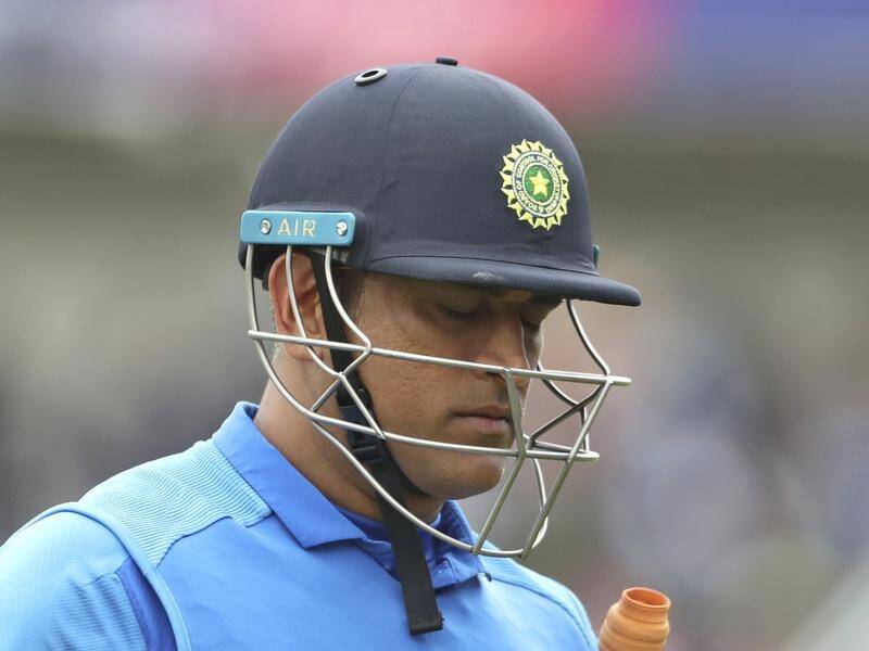 MS Dhoni (pictured) should quit international cricket, according to India great Sunil Gavasker.