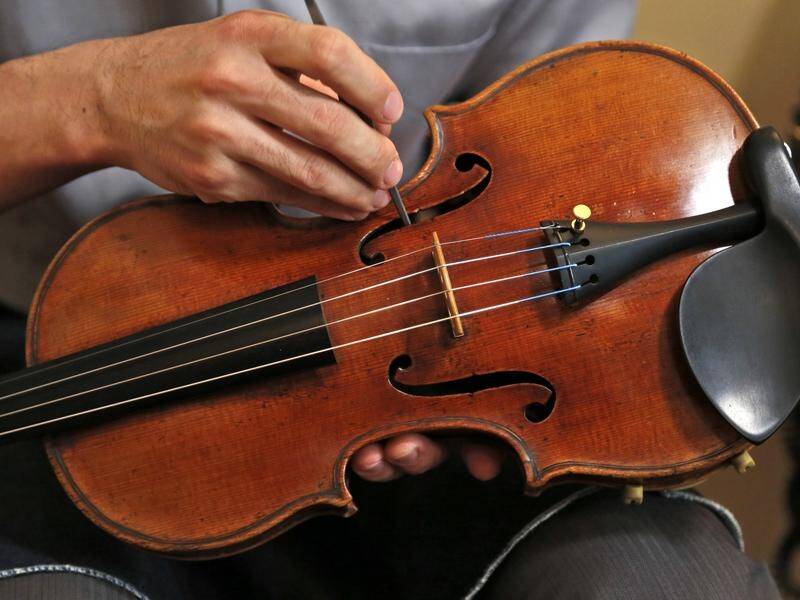 A 310-year-old violin worth nearly $A500,000 has been returned after it was left on a London train.