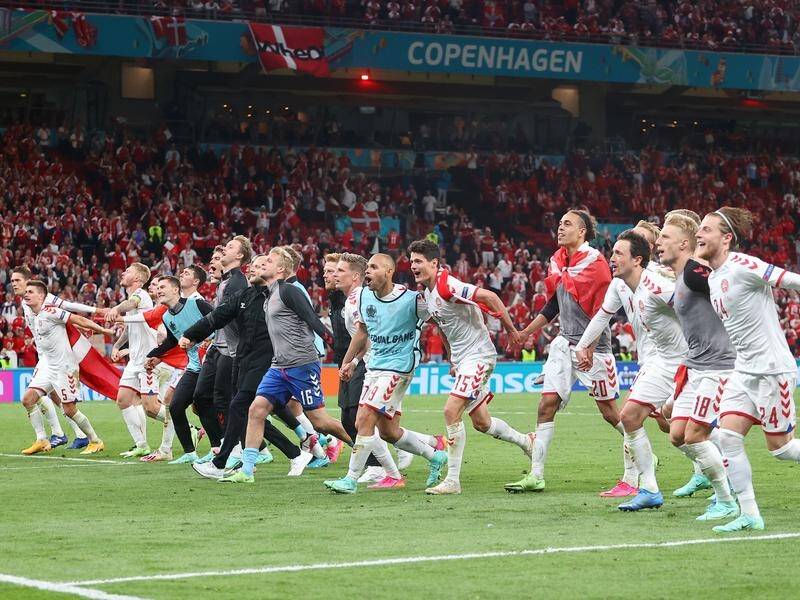 Denmark's squad celebrate with their fans in Copenhagen after their big win over Russia.