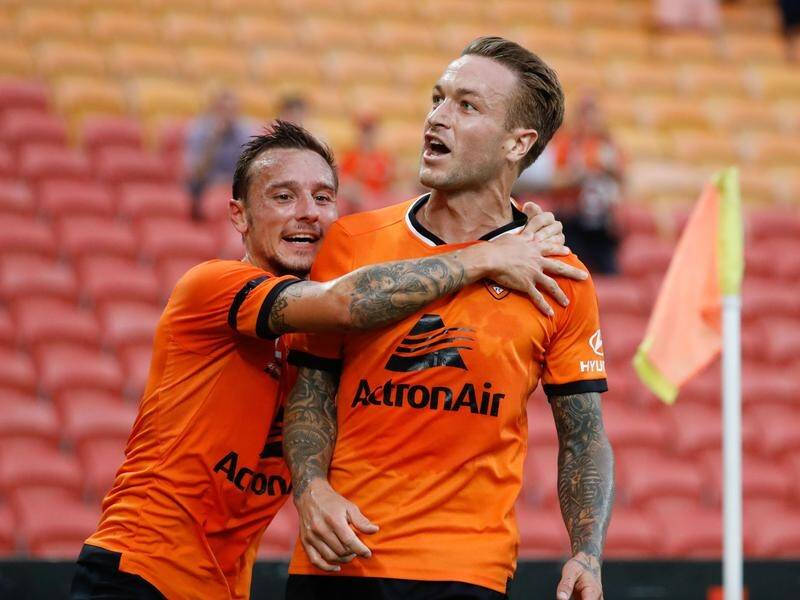 Adam Taggart (right) scored twice for Roar against Perth - but still ended up on the losing side.