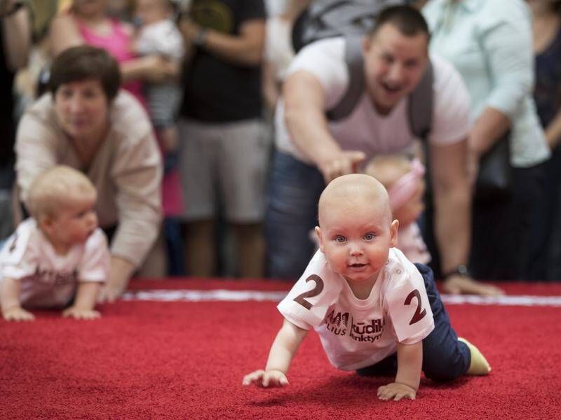 Twenty-five babies have crawled in a contest to mark international Children's Day in Lithuania.