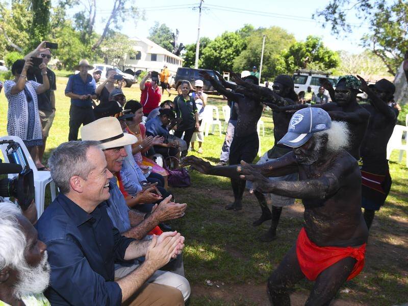 Opposition Leader Bill Shorten watches a dance by Tiwi Islanders on Bathurst Island near Darwin.