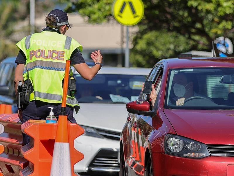 Queensland's border checkpoints are coming down, as the state records nearly 20,000 new COVID cases.