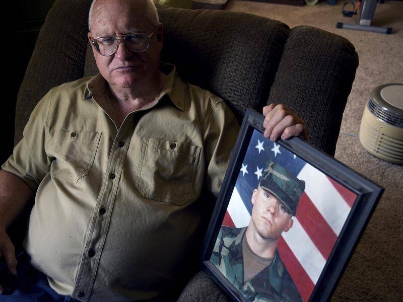 Donn Edmunds of Cheyenne, Wyoming, with a picture of his son John who was killed in the Afghan war.