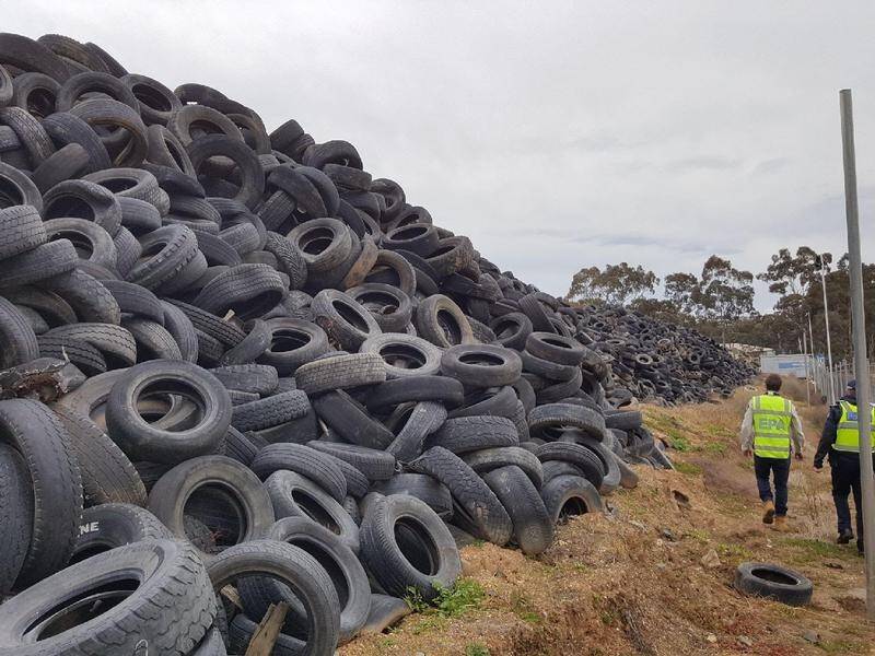 Victoria's environmental watchdog has laid charges against company stockpiling more than 5000 tyres