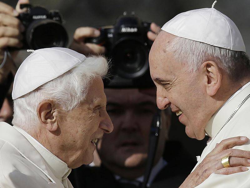 Emeritus Pope Benedict XVI (left) says there is only one pope and that it is Pope Francis (right).