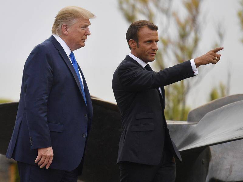 France's President Emmanuel Macron (R) meets US President Donald Trump at the G7 in France.