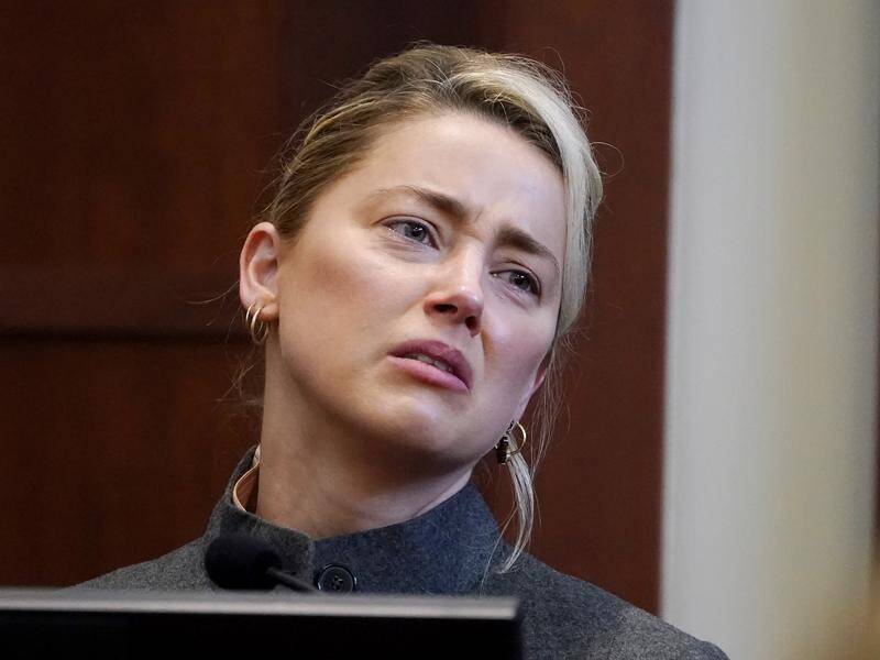 Amber Heard says filing for divorce was hard "was hard because I loved Johnny so much".