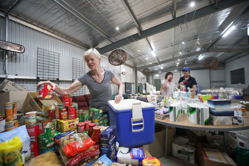 Mary Hoodless putting together food hampers in the wake of the Upper Murray Bushfire. Picture: JAMES WILTSHIRE 