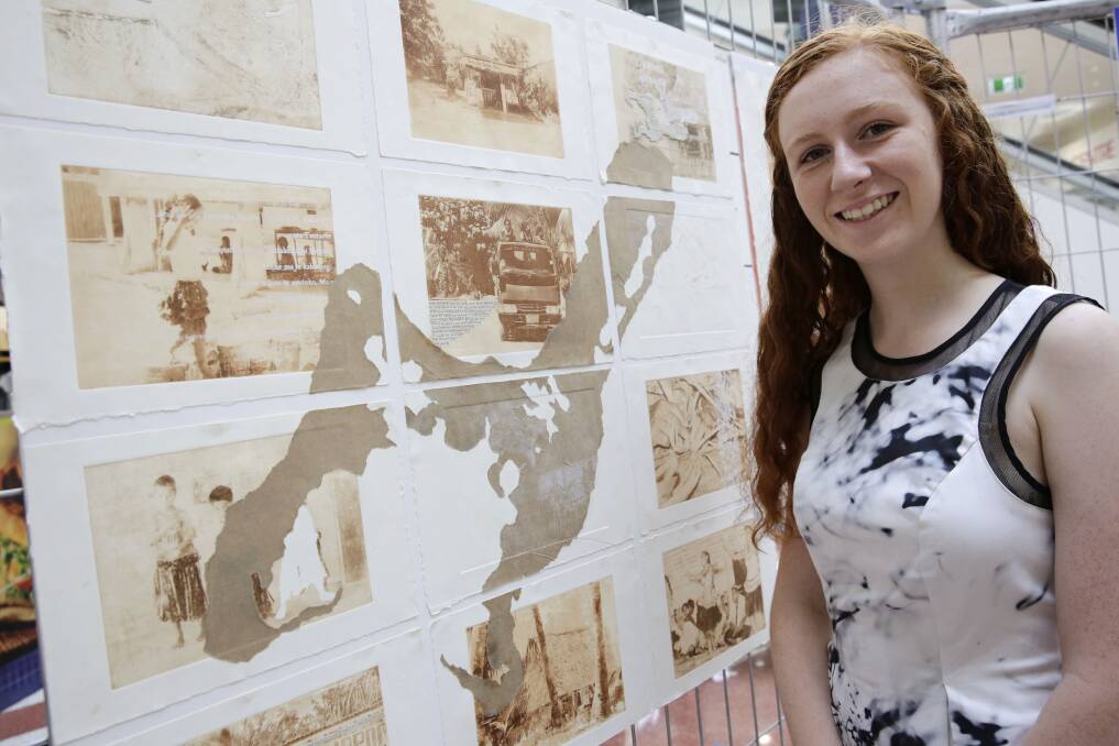 Keziah Duguid, 18, with her HSC artwork about Kiribati. Keziah's work is one of the artworks on display at Macarthur Square Centre Court as part of the Stepping Up HSC program launch. Picture: Anna Warr